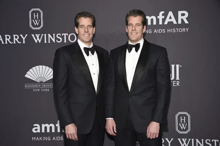 Cameron Winklevoss, left, and Tyler Winklevoss attend amfAR