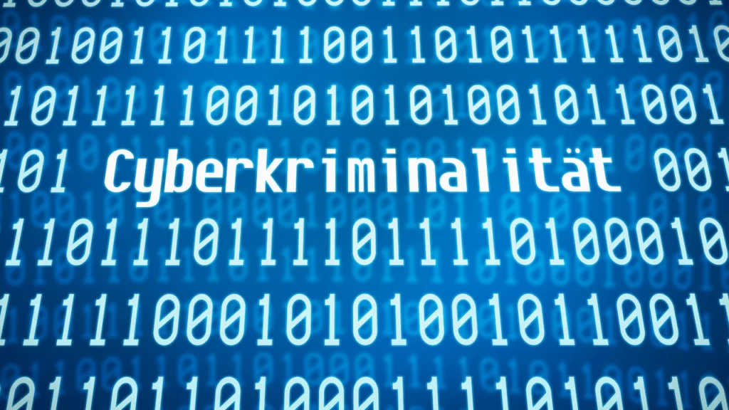 Binärcode mit dem Wort Cyberkriminalität