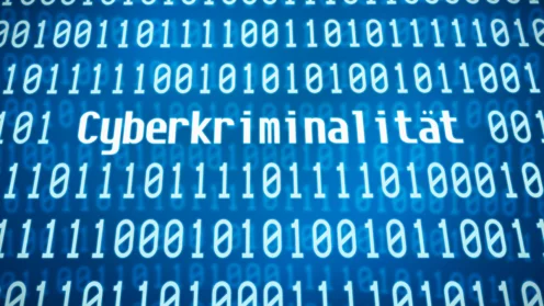 Binärcode mit dem Wort Cyberkriminalität