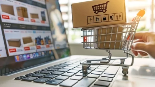 Online shopping on laptop: Person browsing products on a laptop for e-commerce