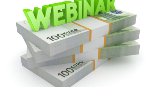 Webinar-Icon auf einem Stapel von 100 Euro Noten
