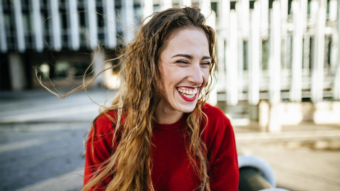 Portrait of happy young woman in the city