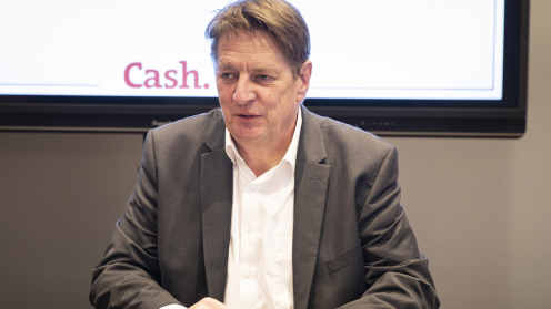 Stefan Löwer auf dem Cash. Branchengipfel
