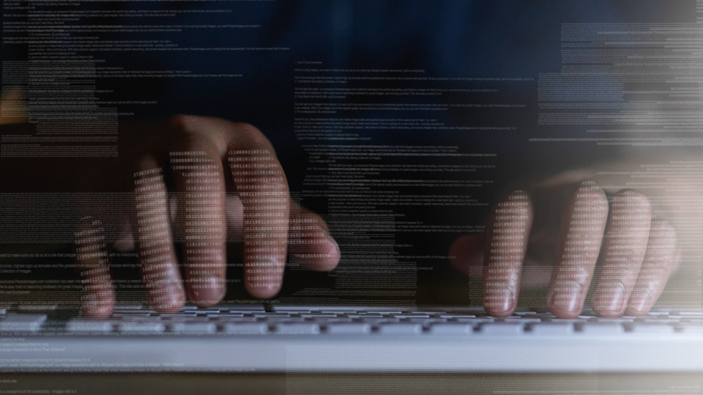 Tapping in to another network. Shot of an unrecognisable hacker