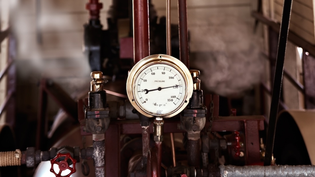 machinery under pressure gauge lets out steam