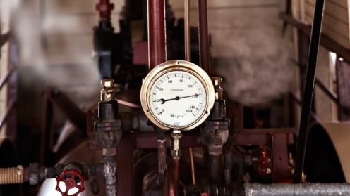 machinery under pressure gauge lets out steam