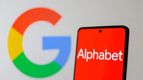 Smarthone mit rotem Display und weissem Alphabet-Logo, hinten verschwommen das Google-Logo
